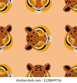 Tiger. Head. Peach background. Rotate 90 degrees. Seamless pattern. Cartoon style