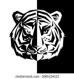 Tiger head silhouette. Illustration tiger muzzle of two inverse black and white parts. Can be used as a logo, a mascot or a t-short print. Vector 10 EPS.