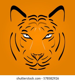 Tiger head silhouette. Vector tiger icon as a design element on orange background