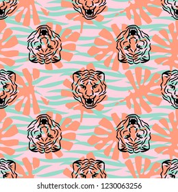 Tiger heads and stripes seamless vector pattern with palm leaves. Wallpaper and textile print design wild cats blue and coral colors.
