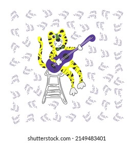 Tiger plays guitar sitting on a chair and sings roar.