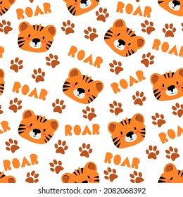 Tiger seamless pattern. Tigers face, cute childish seamless pattern. Colorful background with animal muzzles, paw prints in the Scandinavian style. Decorative wallpaper for printing. Muzzle of tiger.