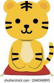 A tiger sitting on a red cushion