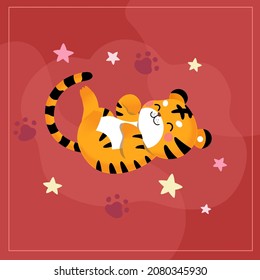 The tiger's limbs are facing upwards, lying on the ground.