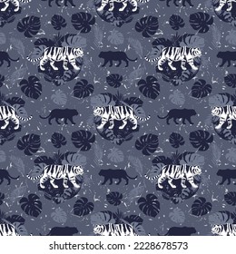 Tigers on a background of tropical leaves. Seamless pattern.Tigers on a background of tropical leaves. Vector image.