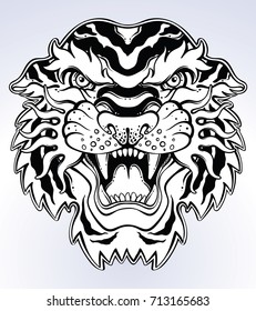 Tiger's portrait made in an old-stylized tattoo. Vector illustration for coloring book, t-shirts, tattoo art, boho design, posters, textiles. Isolated vector illustration.