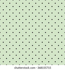 Tile spring vector pattern with black polka dots on fresh grass green background.