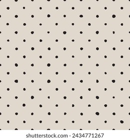 Tile vector pattern with black polka dots on pastel pink background