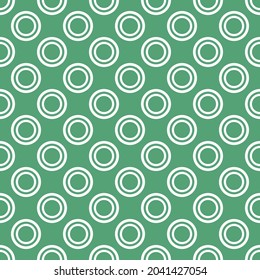 Tile vector pattern with white polka dots on mint green background