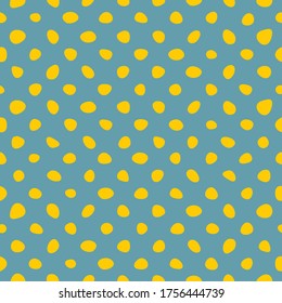 Tile vector pattern with yellow polka dots on pastel mint green background