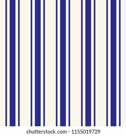 Tileable plain thin dark navy color pinstripe template in artistic simple classic indigo print style on beige fond. Repetition of modern motley bold cobalt strips. Close-up detail view
