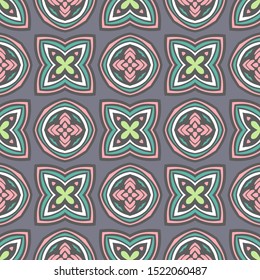 Tiled ethnic colorful pattern for fabric. Abstract geometric mosaic flowers ans circles seamless pattern ornamental.