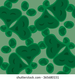 Tiled pattern of seamless smiling green valentine heart shapes