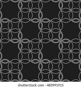 Tiled seamless flower pattern with dotted petals. Floral motif. Beads. Garlands. Abstract black and white mosaic background. Vector illustration.