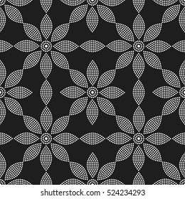 Tiled seamless geometric pattern of dotted flowers and petals. Floral motif. Beads. Grid. Abstract black and white mosaic background. Vector illustration.