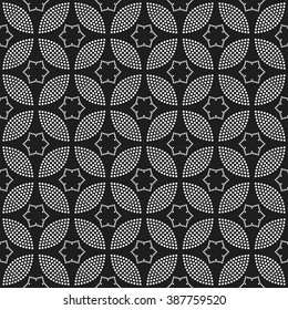 Tiled seamless geometric trellis pattern of dotted petals and flowers. Tracery garlands. Floral motif. Beads. Abstract black and white mosaic background. Vector illustration.
