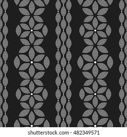 Tiled seamless pattern of hexagons and chains made of dotted petals. Garlands. Abstract black and white mosaic background. Vector illustration.