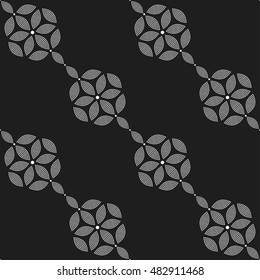 Tiled seamless pattern of hexagons and chains made of dotted petals. Garlands. Abstract black and white mosaic background. Vector illustration.
