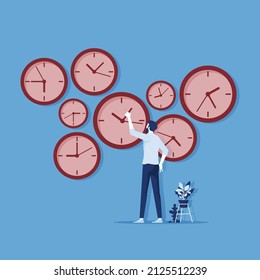 Time control concept, organization of process, businessman standing at wall with clock adjusts time