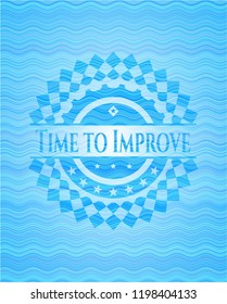 Time to Improve light blue water wave emblem.