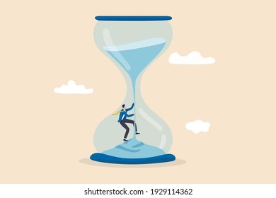 Time management, challenge to overcome to be success, manage to control time, working timeline concept, confidence businessman climbing falling sand as time fly in the hourglass or sandglass.