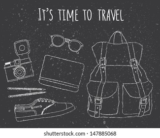 It's time to travel. Traveler's stuff: backpack, glasses, notebook and pencils, camera, shoes. Chalk drawing on black background.