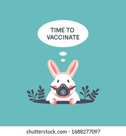 Time to vaccinate. Сute rabbit in a respirator peeps out of a hole during quarantine of Coronavirus Covid-19. A bunny in a medical mask is self-isolating and waiting for a vaccine.