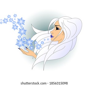 Time of the year. Cold snowy winter in the image of a woman blowing snowflakes