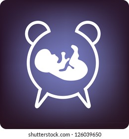 Timing of the baby born - a clock with fetus inside.