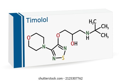 Timolol, Molecule. It Is Non-selective Beta Blocker Medication For Treatment Of Elevated Intraocular Pressure In Ocular Hypertension Or Glaucoma. Skeletal Chemical Formula. Paper Packaging For Drugs. 