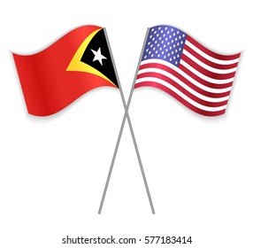 Timorese and American crossed flags. East Timor combined with United States of America isolated on white. Language learning, international business or travel concept.