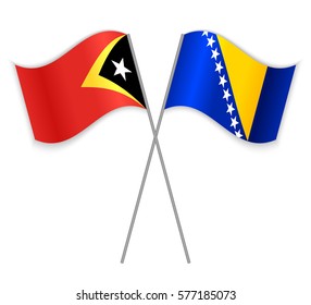 Timorese and Bosnian crossed flags. East Timor combined with Bosnia and Herzegovina isolated on white. Language learning, international business or travel concept.