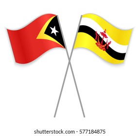 Timorese and Bruneian crossed flags. East Timor combined with Brunei isolated on white. Language learning, international business or travel concept.