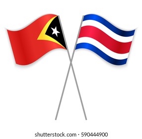 Timorese and Costa Rican crossed flags. East Timor combined with Costa Rica isolated on white. Language learning, international business or travel concept.