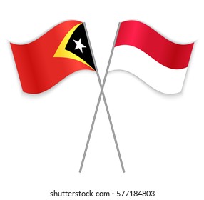 Timorese and Indonesian crossed flags. East Timor combined with Indonesia isolated on white. Language learning, international business or travel concept.