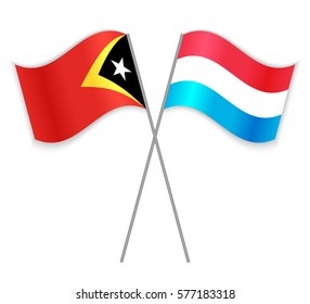 Timorese and Luxembourgish crossed flags. East Timor combined with Luxembourg isolated on white. Language learning, international business or travel concept.