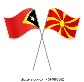 Timorese and Macedonian crossed flags. East Timor combined with Macedonia isolated on white. Language learning, international business or travel concept.