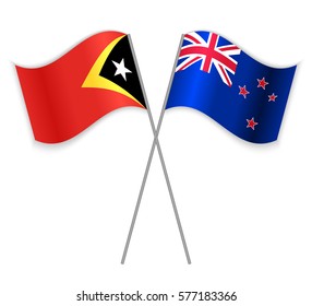 Timorese and NZ crossed flags. East Timor combined with New Zealand isolated on white. Language learning, international business or travel concept.