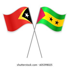 Timorese and Sao Tomean crossed flags. East Timor combined with Sao Tome and Principe isolated on white. Language learning, international business or travel concept.