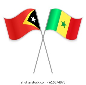 Timorese and Senegalese crossed flags. East Timor combined with Senegal isolated on white. Language learning, international business or travel concept.