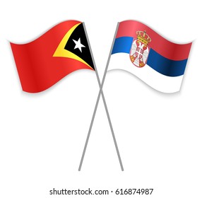 Timorese and Serbian crossed flags. East Timor combined with Serbia isolated on white. Language learning, international business or travel concept.
