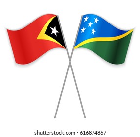 Timorese and Solomon Island crossed flags. East Timor combined with Solomon Islands isolated on white. Language learning, international business or travel concept.