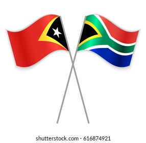 Timorese and South African crossed flags. East Timor combined with South Africa isolated on white. Language learning, international business or travel concept.