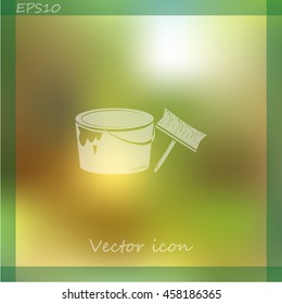 A tin of paint and brush