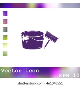 A tin of paint and brush