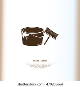A tin of paint and brush