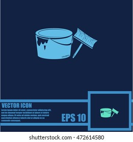 A tin of paint and brush