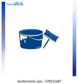 A tin of paint and brush