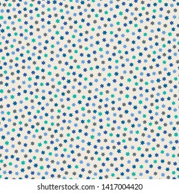 Tiny blue, green and grey stars on a white background in seamless repeat pattern. Sweet tossed vector design ideal for children and background projects.