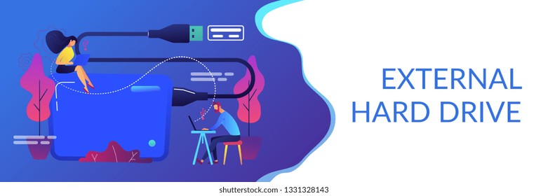 Tiny business people at laptops using portable external hard drive. External hard drive, data storage device, external storage hdd concept. Header or footer banner template with copy space.